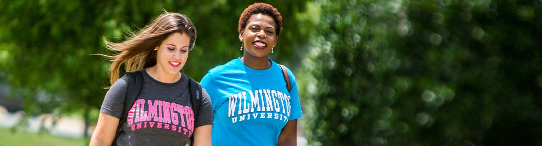 Two WilmU students walking around campus